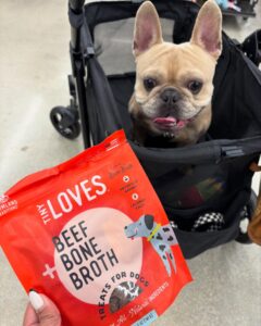 image of dog inside a little car and tiny loves beef with bone broth packaging